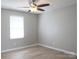 A bright, spacious bedroom features a ceiling fan and a window for natural light at 525 12Th Sw St # 26, Hickory, NC 28602