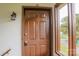 The front door featuring address number 26 and a window, providing natural light into the home at 525 12Th Sw St # 26, Hickory, NC 28602