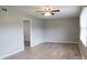 The bright living room boasts laminated wood floors, neutral colored walls, and a ceiling fan at 525 12Th Sw St # 26, Hickory, NC 28602
