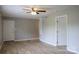 Spacious living room featuring laminated wood floors, neutral-colored walls, and a ceiling fan at 525 12Th Sw St # 26, Hickory, NC 28602
