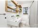 Modern bathroom with sleek fixtures, unique sink and shower with natural light at 630 S Myrtle School Rd, Gastonia, NC 28052