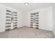 Neutral bedroom with carpeting and well-lit windows at 630 S Myrtle School Rd, Gastonia, NC 28052