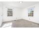 Bright, airy bedroom featuring carpeting and natural light from dual windows at 630 S Myrtle School Rd, Gastonia, NC 28052