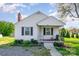 Charming single-Gathering home featuring black shutters, a brick chimney, and a cozy front porch with rod iron railings at 630 S Myrtle School Rd, Gastonia, NC 28052