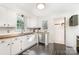 Bright kitchen with white cabinets, stainless steel appliances, wood countertops and natural light at 630 S Myrtle School Rd, Gastonia, NC 28052