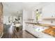 Bright kitchen with white cabinets, stainless steel appliances, wood countertops, and access to the dining area at 630 S Myrtle School Rd, Gastonia, NC 28052