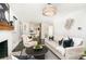 Stylishly designed living room, showcasing a fireplace, modern lighting, and a comfortable seating area at 630 S Myrtle School Rd, Gastonia, NC 28052