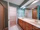 Primary bathroom with a double sink vanity and a walk-in closet at 907 Weymouth Dr, Gastonia, NC 28056