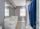 Traditional bathroom with patterned wallpaper, large vanity, tub, and walk-in shower at 907 Weymouth Dr, Gastonia, NC 28056