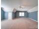 Spacious bedroom with sloped ceilings, neutral carpet, and a window for natural light at 907 Weymouth Dr, Gastonia, NC 28056