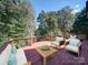 Comfortable outdoor deck with a seating area, ideal for enjoying the natural surroundings at 907 Weymouth Dr, Gastonia, NC 28056