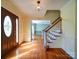 A beautiful foyer with hardwood floors and a staircase at 907 Weymouth Dr, Gastonia, NC 28056