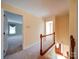 Carpeted hallway shows rooms and the stairs going down at 907 Weymouth Dr, Gastonia, NC 28056