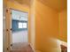Hallway with view of a blue room with carpet and two windows at 907 Weymouth Dr, Gastonia, NC 28056