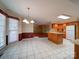 Bright kitchen with tile floors, wood cabinets, and an open layout at 907 Weymouth Dr, Gastonia, NC 28056