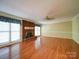 Spacious living room with a brick fireplace and hardwood floors at 907 Weymouth Dr, Gastonia, NC 28056