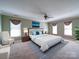 Spacious main bedroom with a ceiling fan and large windows at 907 Weymouth Dr, Gastonia, NC 28056
