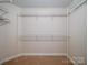 Walk-in closet with built-in shelving and ample storage space at 907 Weymouth Dr, Gastonia, NC 28056