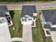 Birds eye view of a house with a gray roof, white siding and long driveway at 1007 Freeman View Dr, Albemarle, NC 28001