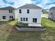 The backyard featuring a patio and landscaped retaining wall at 1007 Freeman View Dr, Albemarle, NC 28001