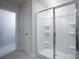 Bathroom featuring a glass enclosed shower with built-in shelves at 1007 Freeman View Dr, Albemarle, NC 28001