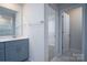 Bright bathroom featuring a gray vanity with quartz countertops and tiled floors at 1007 Freeman View Dr, Albemarle, NC 28001