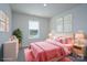 Cozy bedroom featuring a comfortable bed, soft lighting, a window, and tasteful decor, a peaceful retreat at 1007 Freeman View Dr, Albemarle, NC 28001