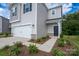 Close-up of home entrance with a manicured lawn and two-car garage at 1007 Freeman View Dr, Albemarle, NC 28001