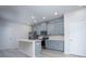 Bright kitchen featuring blue cabinets, stainless steel appliances, and a kitchen island at 1007 Freeman View Dr, Albemarle, NC 28001