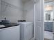 Convenient laundry room with washer, dryer, and shelving at 1007 Freeman View Dr, Albemarle, NC 28001