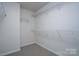 Spacious walk-in closet with carpet flooring and wire shelving at 1007 Freeman View Dr, Albemarle, NC 28001