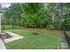 Landscaped backyard with lush greenery at 3150 Helmsley Ct, Concord, NC 28027