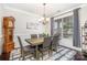 Formal dining room with wood table and gray chairs at 3150 Helmsley Ct, Concord, NC 28027