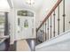 Bright entryway with hardwood floors and staircase at 3150 Helmsley Ct, Concord, NC 28027