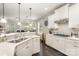 Modern kitchen with white cabinets, stainless steel appliances, and a large island at 3150 Helmsley Ct, Concord, NC 28027