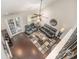 Upstairs living room with dark hardwood floors, leather furniture, and access to a patio at 3150 Helmsley Ct, Concord, NC 28027