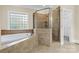 Spa-like bathroom featuring a soaking tub and shower at 4800 Pimlico Ln, Waxhaw, NC 28173