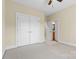 Spacious bedroom with double doors and en-suite bathroom at 4800 Pimlico Ln, Waxhaw, NC 28173