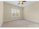 Bright bedroom with neutral walls and carpet at 4800 Pimlico Ln, Waxhaw, NC 28173