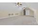 Spacious bonus room with ceiling fans and built-in shelving at 4800 Pimlico Ln, Waxhaw, NC 28173