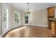 Breakfast room featuring hardwood floors, a chandelier, and backyard access at 4800 Pimlico Ln, Waxhaw, NC 28173