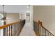 Upstairs hallway with wood railing and carpet at 4800 Pimlico Ln, Waxhaw, NC 28173