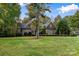 Two-story brick home with a gabled roof and landscaping at 4800 Pimlico Ln, Waxhaw, NC 28173