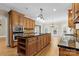 Modern kitchen with ample cabinetry, granite countertops, and an island at 4800 Pimlico Ln, Waxhaw, NC 28173