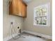 Laundry room with upper cabinets and a window at 4800 Pimlico Ln, Waxhaw, NC 28173