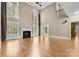 Spacious living room featuring hardwood floors, a fireplace, and large windows at 4800 Pimlico Ln, Waxhaw, NC 28173