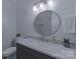 Stylish bathroom featuring a modern vanity with a quartz countertop and shiplap wall at 10604 Russet Pl, Charlotte, NC 28227