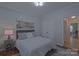 Inviting bedroom featuring a neutral color scheme, soft carpet, and ample natural light at 10604 Russet Pl, Charlotte, NC 28227