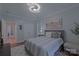 Comfortable bedroom with plush bed, decorative art, and access to en-suite bathroom at 10604 Russet Pl, Charlotte, NC 28227