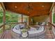 Spacious covered deck with cozy seating arrangements and outdoor views, perfect for relaxing and entertaining at 10604 Russet Pl, Charlotte, NC 28227
